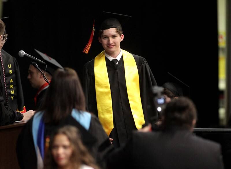 Abram Marcus Alley walks across the stage for his diploma during Batavia High School’s 2023 commencement ceremony at Northern Illinois University in DeKalb on Wednesday, May 24, 2023.
