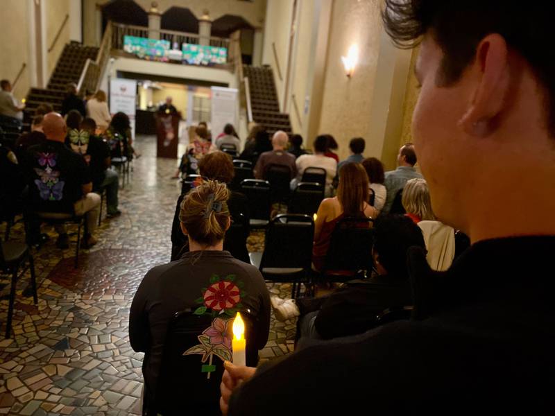 Participants gathered for a solemn candlelight vigil as the lights dimmed at the annual Safe Passage Domestic Violence Candlelight Vigil and Survivor Speak-Out inside the Egyptian Theatre, 135 N. Second St. in downtown DeKalb on Monday, Oct. 2, 2023.
