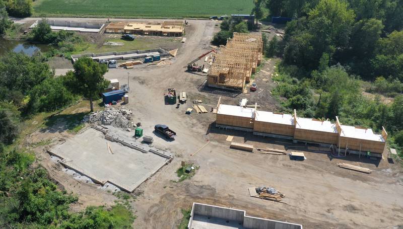 A crew builds new cabin units on Monday, Aug. 28, 2023 at Grand Bear Resort at Starved Rock in Utica. A massive fire destroyed 28 units on Memorial Day Weekend in 2022.