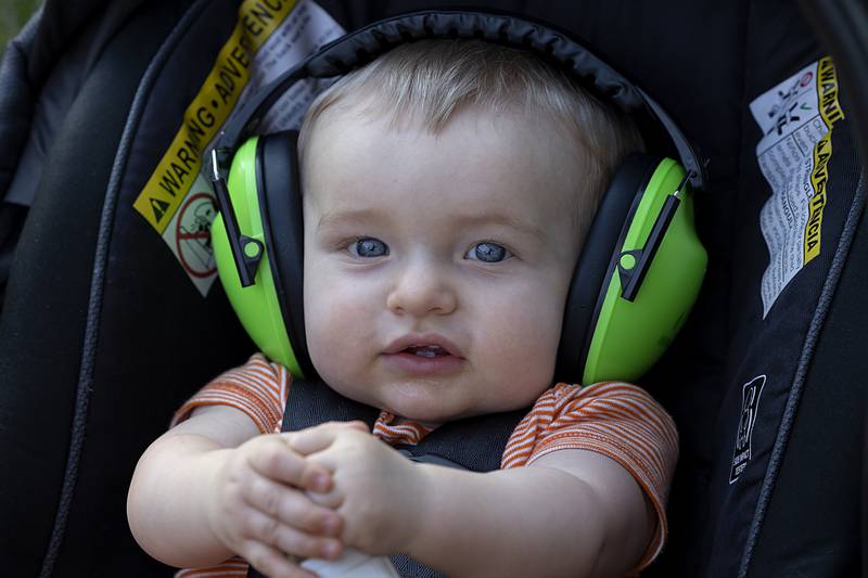 Hank Heeren sports hearing protection while watching dad drive Wednesday, Aug. 7, 2024 in the tractor pulls at the Carroll County Fair.