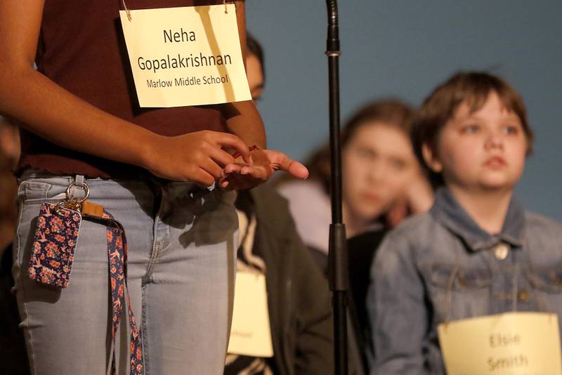 Neha Gopalakrishnan of Marlowe Middle spells a word on her hand with her fingers during the McHenry County Regional Office of Education 2023 Spelling Bee to look over some of the words on Wednesday, March 22, 2023, at McHenry County College's Luecht Auditorium in Crystal Lake.