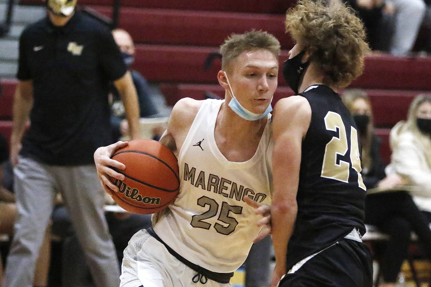 Marengo's Matthew Volkening drives into Grayslake North's Jacob Donahue to draw a foul during their EC Nichols Holiday Tournament boys basketball game on Monday, Dec. 20, 2021 at Marengo Community Unit High School in Marengo.