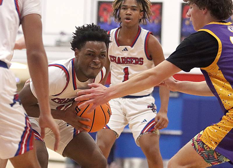 Dundee-Crown’s Terrion Spencer battles under the hoop against Wauconda in varsity basketball Friday, Dec. 20, 2024 at Dundee-Crown High School in Carpentersville.