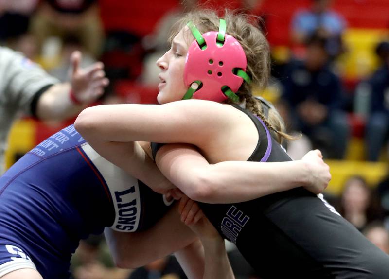 Hampshire’s Annabelle Mueller, right, battles St. Viator’s Charlotte Nold at 105 pounds in varsity girls IHSA Sectional wrestling on Saturday, February 14, 2026, at Schaumburg High School in Schaumburg.