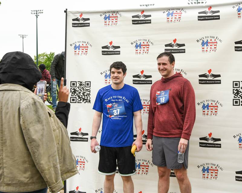 Oliver Dubois, left, and Alec Colligan pose for a photo after completing the Race to the Flag 5k on Sunday May 25, 2025, held at Ty Warner Park in Westmont.