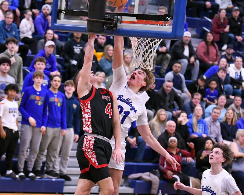 Riverside-Brookfield's Colin Cimino, right, blocks the shot of Glenbard East's Michael Nee (4) during the game on Tuesday Feb. 3, 2026, held at Riverside-Brookfield High School.