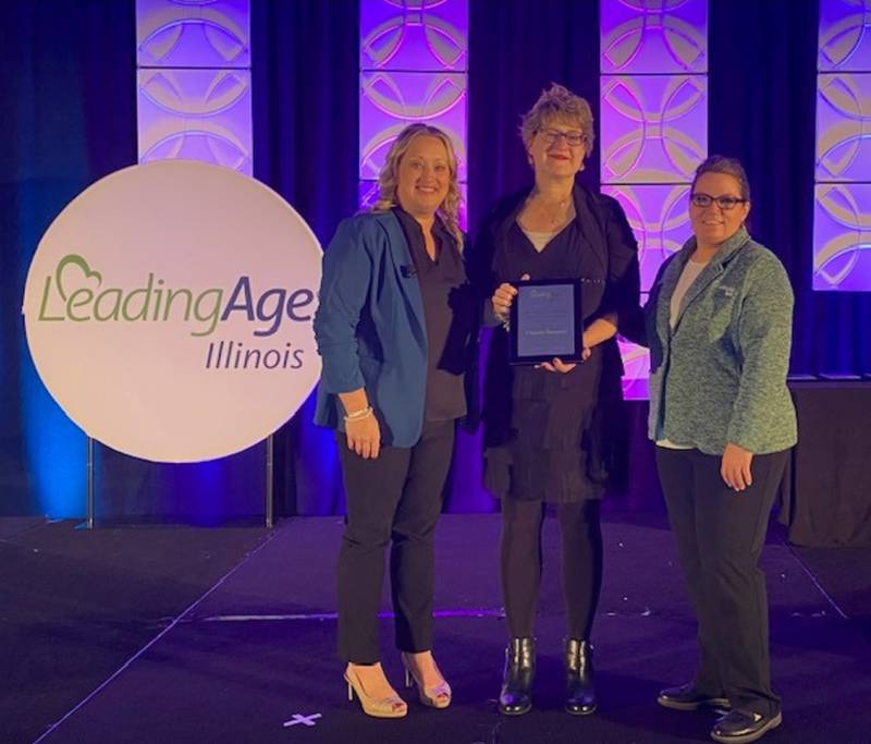 Greenfield Retirement Home Activity Director Christine Thompson was presented with the Heart and Hands Award during the Honoring Excellence Awards Ceremony at the Annual Leading Age Expo.