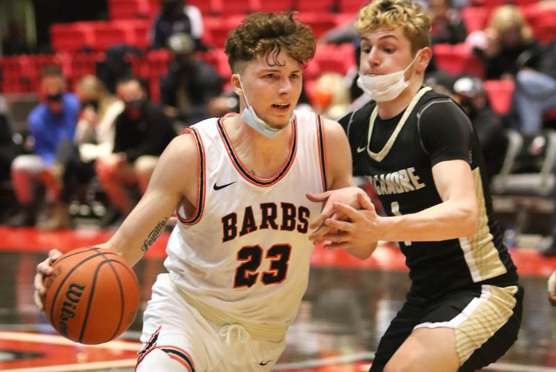 DeKalb's Lane Mcvicar tries to get by Sycamore's Brody Armstrong during the First National Challenge Friday, Jan. 28, 2022, at The Convocation Center on the campus of Northern Illinois University in DeKalb.