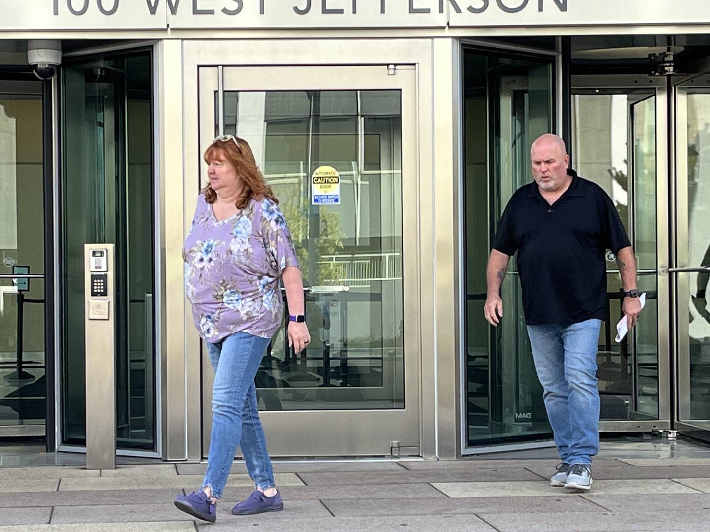 Penny Knowlton (left) and Remon Knowlton leave the Will County Courthouse on Wednesday, Sept. 25, 2024, in Joliet.