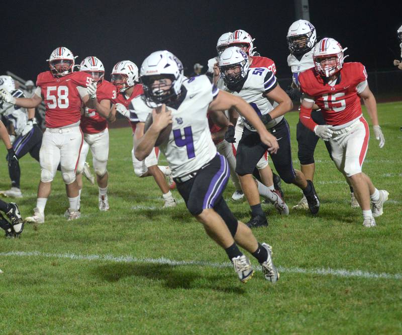 Dixon's Landon Knigge (4) runs for a touchdown against Oregon on Friday, Sept. 26, 2025 at Landers-Loomis Field in Oregon.