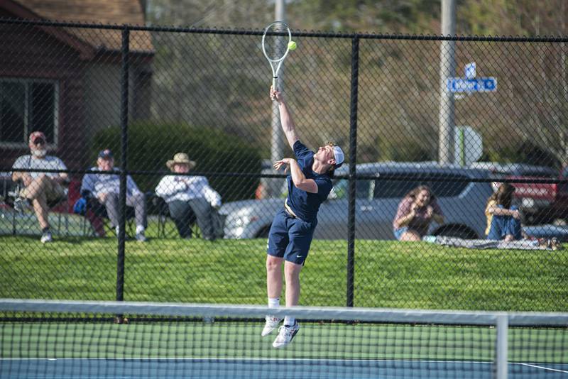 Sterling’s Ben Boze serves against Newman’s Griffin Moran and James Rhodes Monday, May 9, 2022. Boze was playing with doubles partner Kayden Loos.