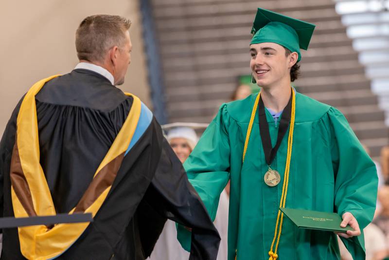 Graduate Cody Clennon shakes Dr. Dan Stecken's hand after receiving his diploma during the Seneca High School Class of 2026 Graduation on May 17, 2026 at Seneca High School.
