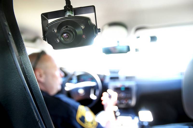 DeKalb County Sheriff's Chief Deputy Gary Dumdie talks Monday about the camera equipment and technology used in the deputies' cars.  The cars have two videos cameras with audio in them, one pointing forward to record oncoming traffic and road stops, and the other directed at the back seat to reord transports.