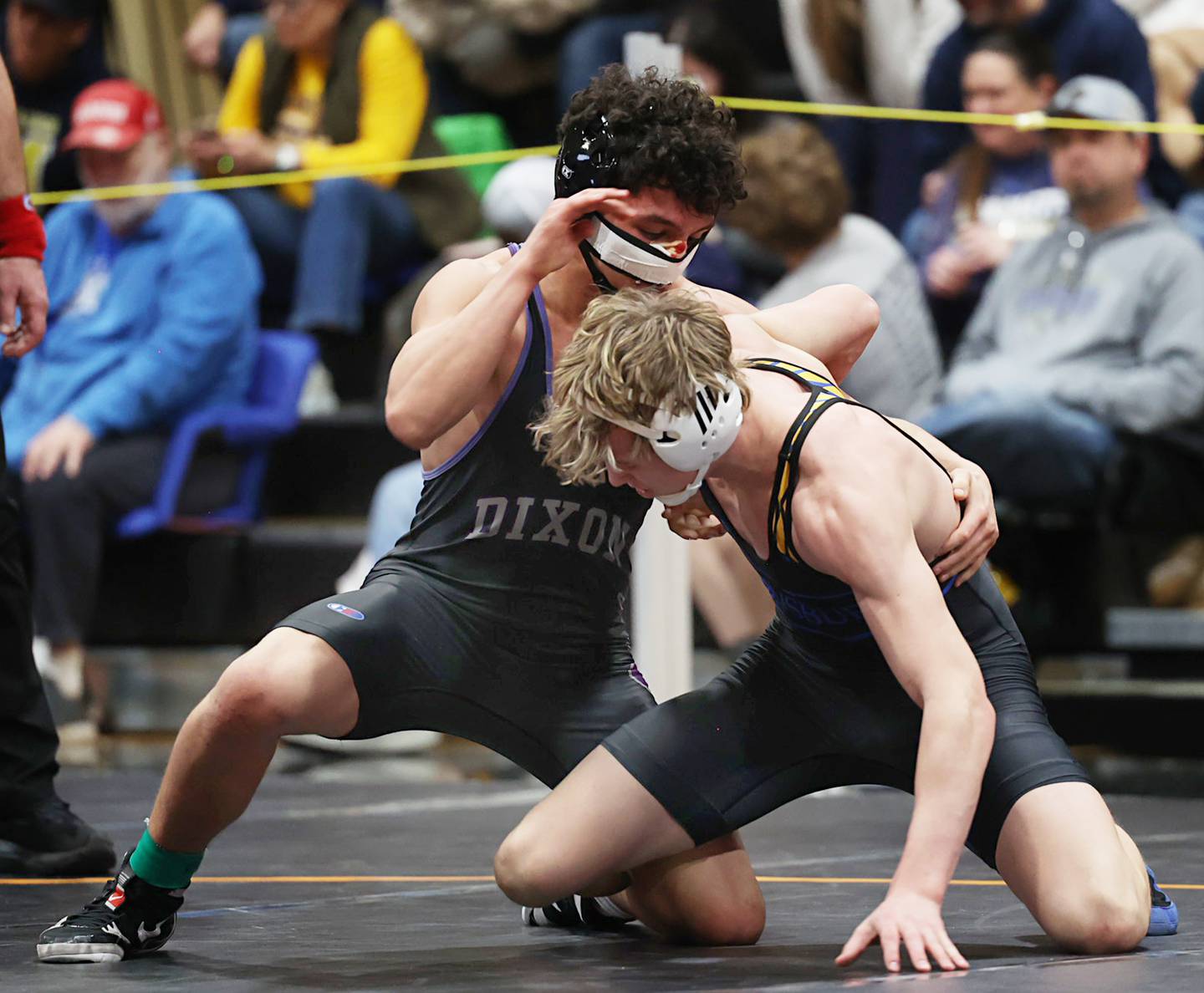 Dixon’s Preton Richards and Johnsburg’s Tanner Hansen farce off in the 150 pound third place match Saturday, Feb. 14, 2026, during the Class 1A wrestling sectionals in Byron.