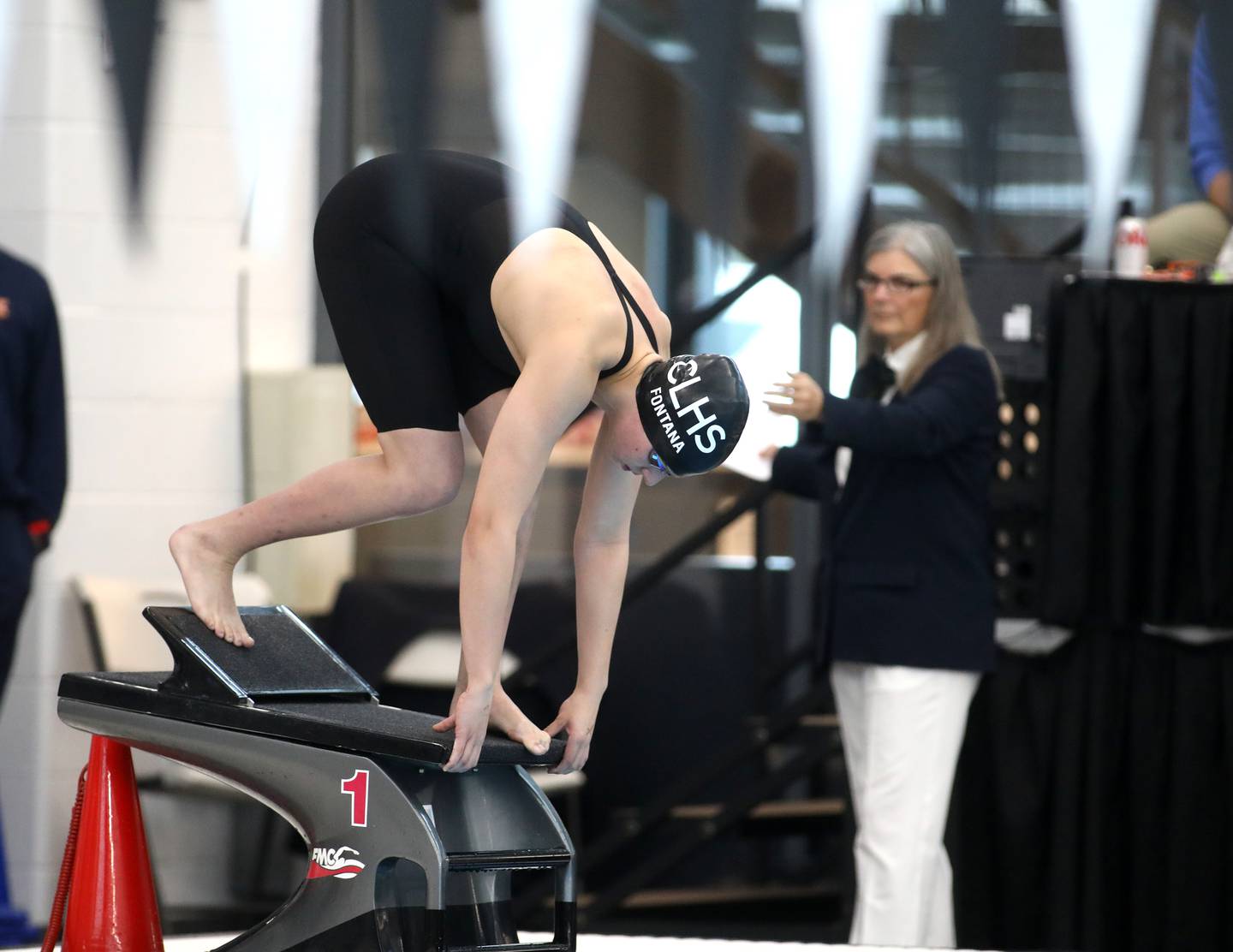 Crystal Lake co-op’s Isabella Fontana takes off from the blocks in the 200-yard freestyle consolation heat during the IHSA Girls State Championships on Saturday, Nov. 16, 2024 at FMC Natatorium in Westmont.