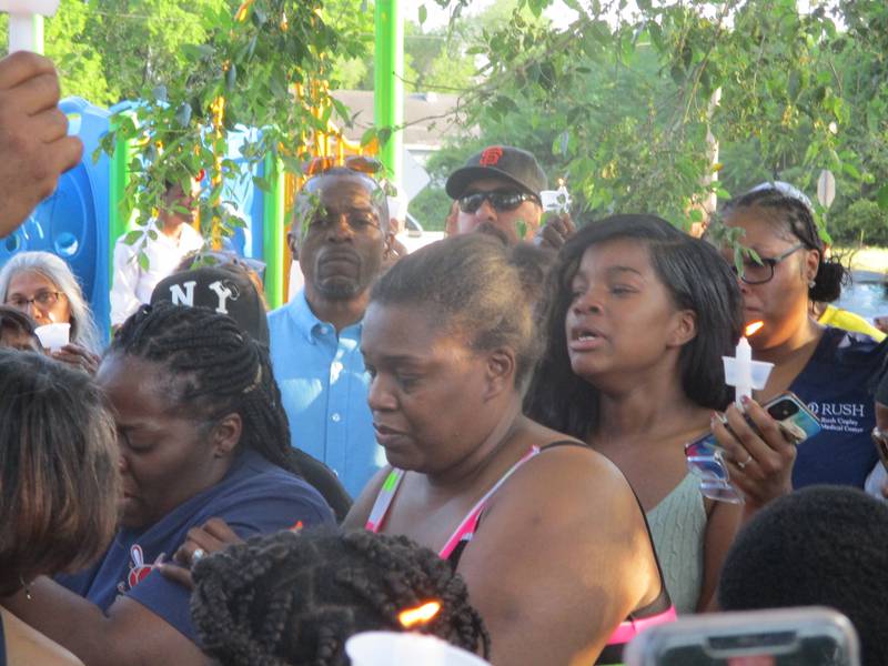 Antoine Shropshire's family grieves as candles are lit at a vigil to remember him on Friday, June 2, 2023 in Joliet.