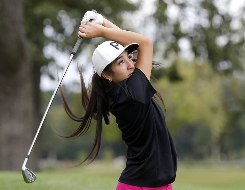 Hampshire’s Estancia Arenas watches her tee shot on the 13th hole during the Fox Valley Conference Girls Golf Tournament Wednesday, Sept. 24, 2025, at Crystal Woods Golf Club in Woodstock.