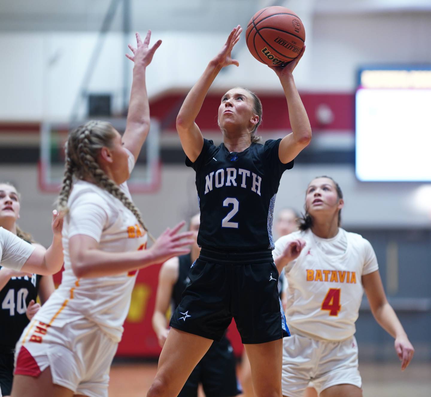 St. Charles North's Reagan Sipla (2) shoots the ball in the post against Batavia’s Kylee Gehrt (21) 2during a basketball game at Batavia High School on Tuesday, Dec 5, 2023.