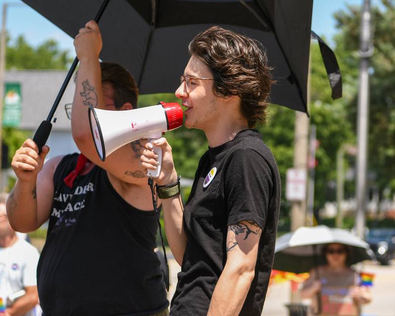 Dylan Simons, 27, of DeKalb speaks during a Trans Resilience Rally held on Sunday, June 22, 2025, in downtown DeKalb. Organizers said the rally was to show public support for people they believe are unjustly and harmfully targeted under President Donald Trump's policies.