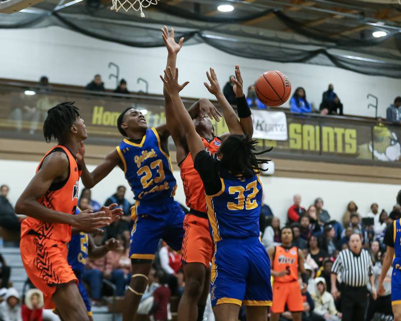 Romeoville's DJ Porter Jr (23) is fouled by Joliet Central's Danny Thompson (23) in the WJOL Tournament Championship game. Nov 25, 2023.