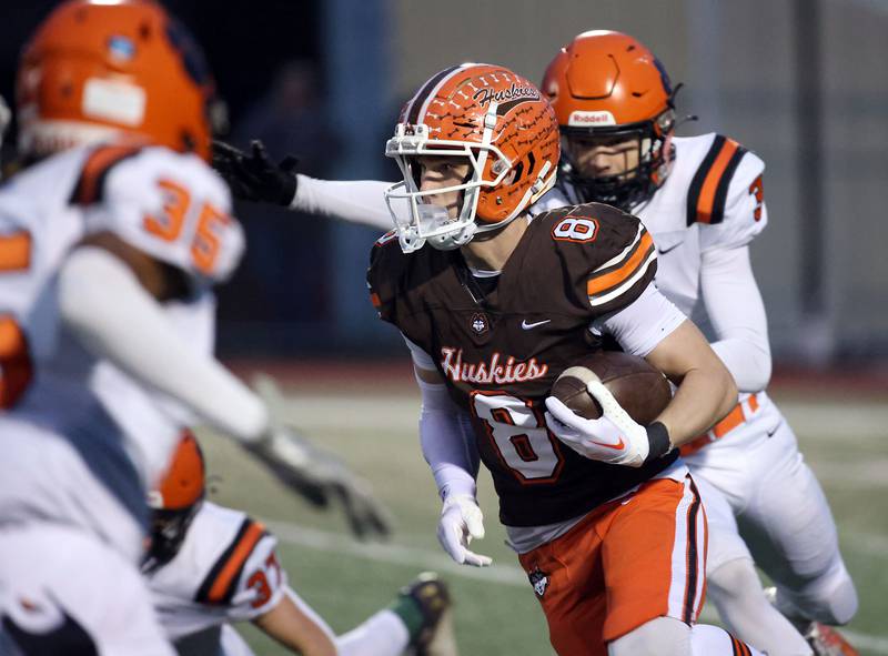 Hersey's Carson Grove (8) looks for running room against Wheaton Warrenville South during the IHSA Class 7A playoffs Saturday October 28, 2023 in Arlington Heights.