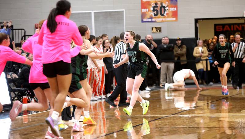 Glenbard West's Julia Benjamin celebrates following a Class 4A St. Charles East Sectional semifinal against St. Charles East on Tuesday, Feb. 25, 2025 in St. Charles.