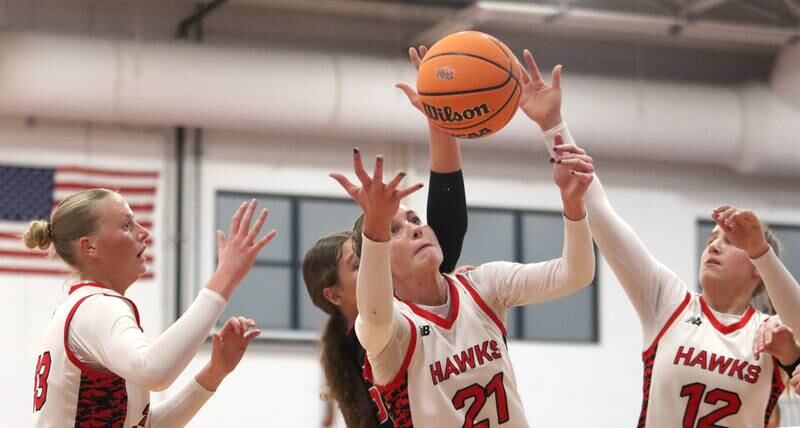 From left, Maine South’s Emily Currey, Asia Kobylarczyk, and Katie Barker look for the ball against Huntley in Komaromy Holiday Classic varsity girls basketball championship game action on Monday, Dec. 30, 2024, at Dundee-Crown High School in Carpentersville.