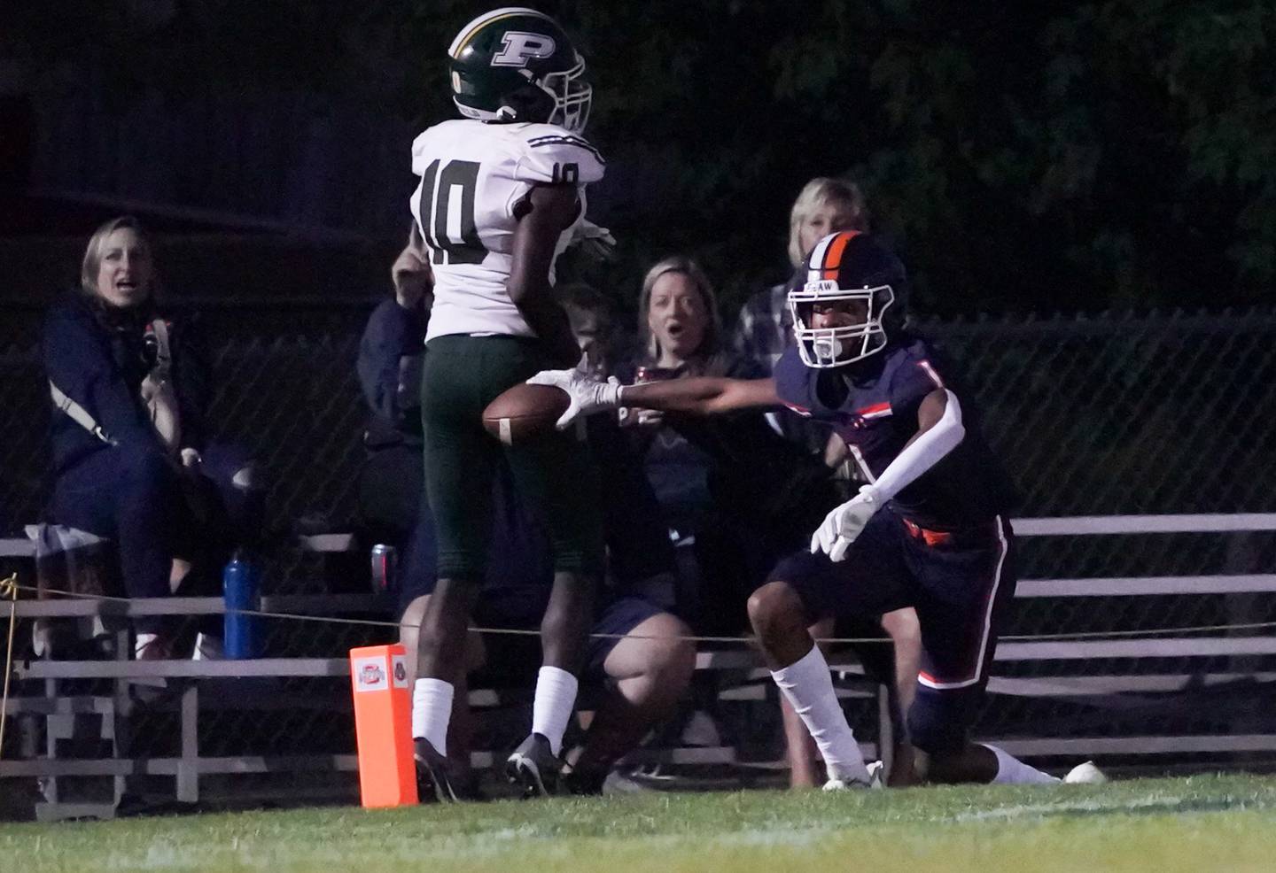Oswego’s Jeremiah Cain (1) reacts after scoring a touchdown against Plainfield Central's Stephon Griffin (10) during a football game at Oswego High School on Friday, Sept. 8, 2023.