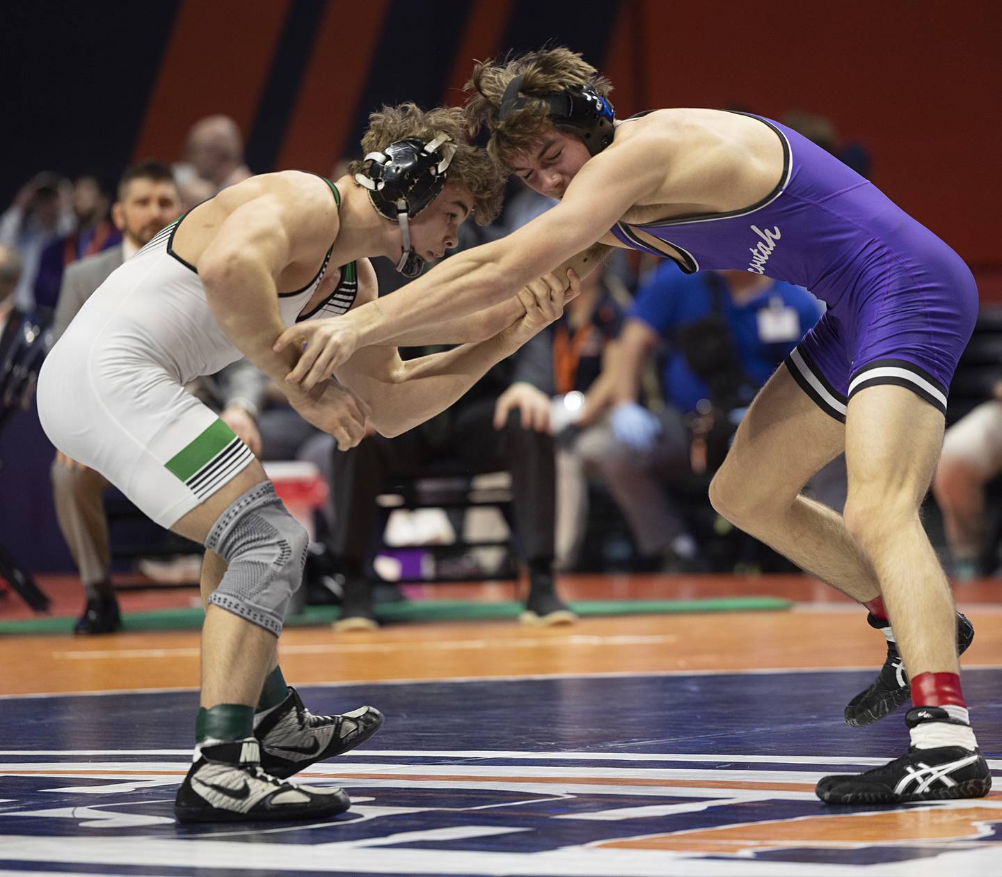 Providence Catholic’s Justus Heeg works against Brock Ross of Mascouta in the 2A 157 pound title Saturday, Feb. 21, 2026, at the IHSA wrestling finals in Champaign.