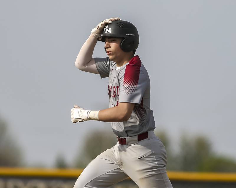 Plainfield North's Ryan O'Connor (4) rounds the bases after hitting a homerun during baseball game between Plainfield North at Oswego East, Monday, April 28, 2025 in Oswego.
