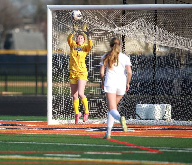 Lyons Township goalkeeper Anna Bigenwald makes a save during a game against Naperville North on Wednesday, April 16, 2025 in Naperville.
