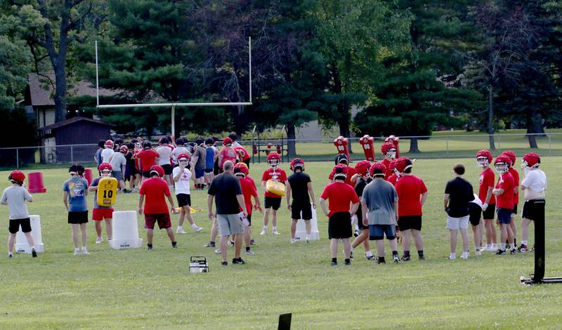 Members of the Hall football team run drills during the first day of football practice on Monday, Aug. 11, 2025 at Hall High School.