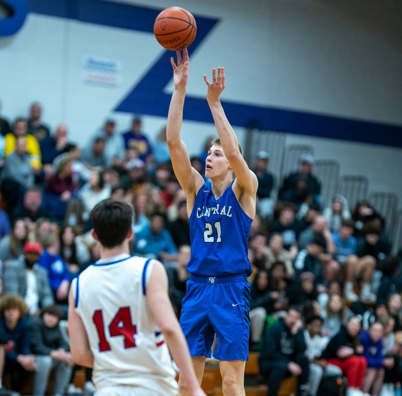Burlington Central's Andrew Scharnowski (21) shoots a three-pointer against Marmion during the 59th Annual Plano Christmas Classic basketball tournament championship game at Plano High School on Friday, Dec 30, 2022.
