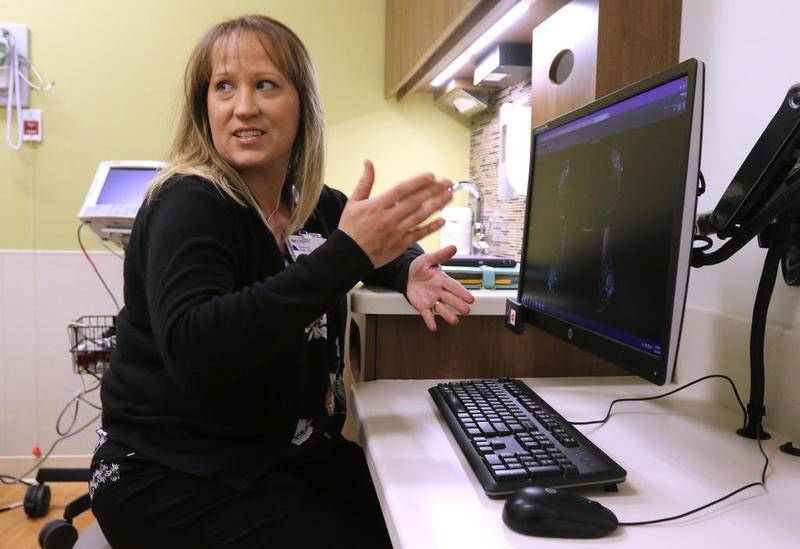 Kimberly Aldis, a nurse practitioner and nurse navigator at Northwestern Medicine Kishwaukee Hospital Cancer Center, talks Monday at the center about what they look for when reviewing a mamogram. Construction has begun on a new breast health center at the facility which they hope will be opening in October.