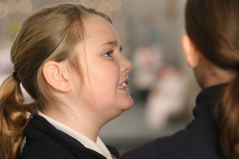 Quinn Taylor of Trinity Catholic Academy, sings in the choir during the All Schools Mass on Thursday, Feb. 20, 2025 at St. Patrick's Catholic Church in La Salle.  The Most Reverend Bishop Louis Tylka, Bishop of Peoria gave Mass while announcing a new name for the three schools calling it Carlo Acutis. Last year, the Catholic Diocese of Peoria announced the consolidation of the three schools. Carlo Acutis Canonization will take place on Sunday, April 27, 2025 during the Jubilee of Teenagers in Rome. Acutis is the first millennial saint, representing those born between the early 1980's and the late 1990's. He is celebrated for cataloging miracles and online and managing websites for Catholic organizations.
