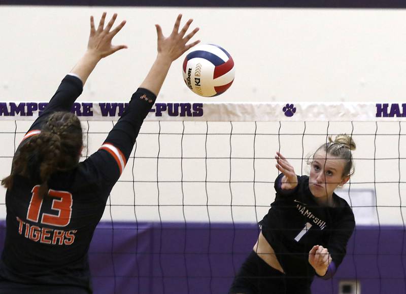 Hampshire's Elizabeth King (right) tries to hit the ball past the block attempt of Crystal Lake Central's Siena Smiejek during a Fox Valley Conference volleyball match on Tuesday, Sept. 24, 2024, at Hampshire High School.