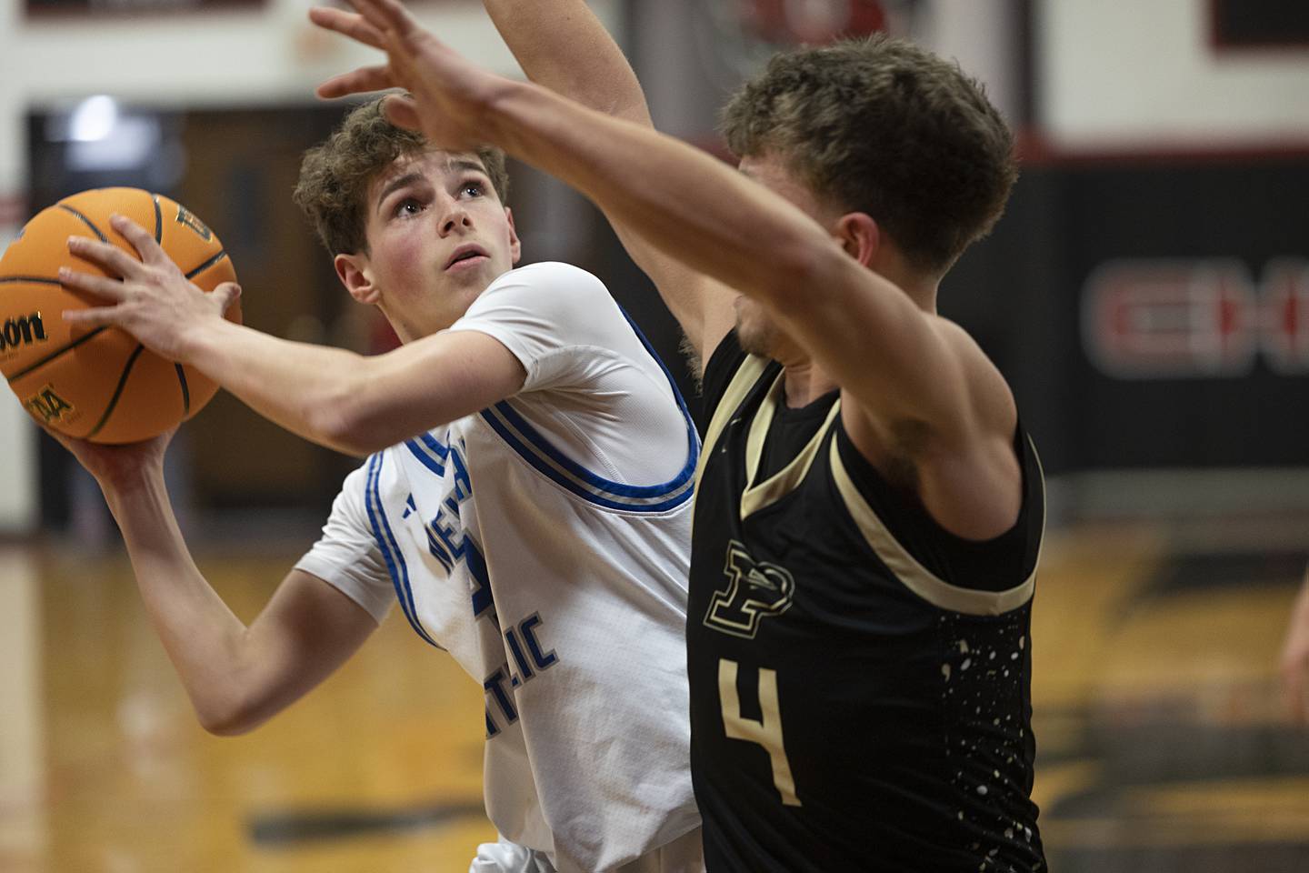 Newman’s Easton Coward looks to put up a shot against Pecatonica’s Blake Fox Tuesday, March 3, 2026, in the 1A sectional semifinal.