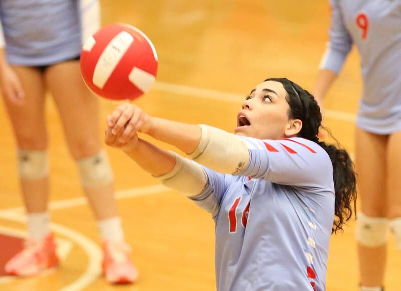 Ottawa's Chey Joachim returns a serve from Sycamore on Thursday, Oct. 12, 2023 at Kingman Gym.