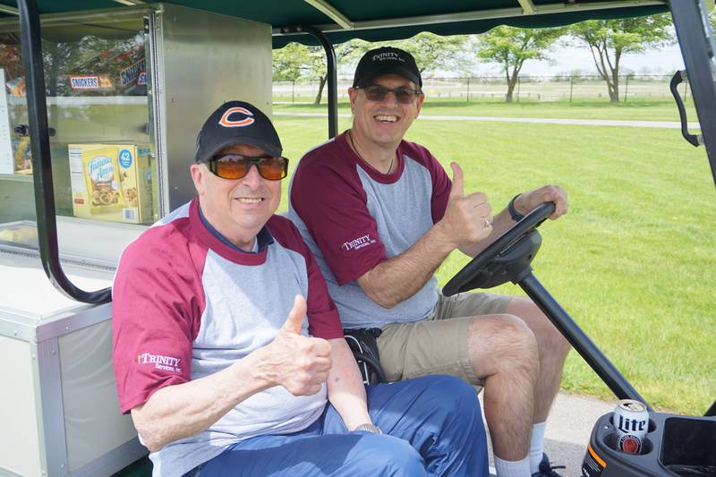 The 28th Annual Tom O'Reilly Memorial Golf Classic will be held May 19 at the Odyssey Golf Club in Tinley. Foursome slots are still available. Proceeds benefit Trinity Services in New Lenox. Pictured are the 2021 golf classic are, from left:  Charley Smith, chairperson of the Trinity foundation, and Thane A. Dykstra, president and CEO of Trinity Services.