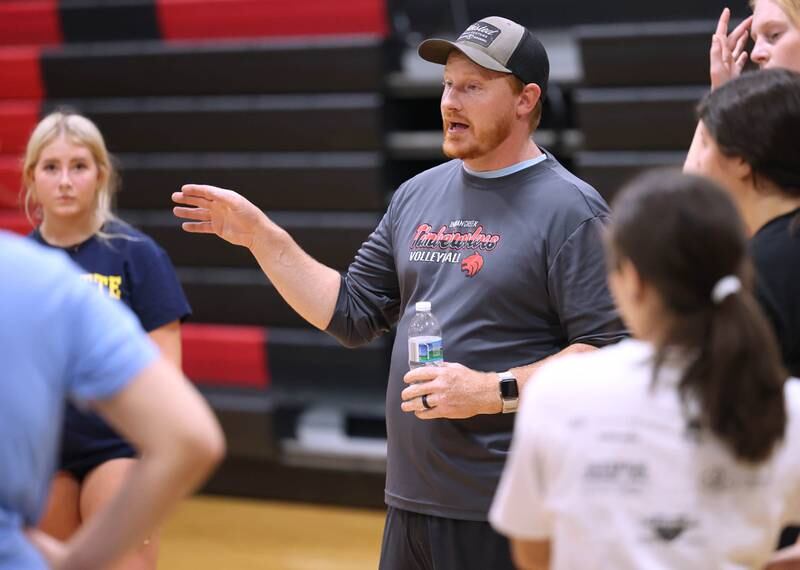 Indian Creek head volleyball coach Matthew Orstead talks to his team during practice Tuesday, Aug. 13, 2024, at the school in Shabbona.