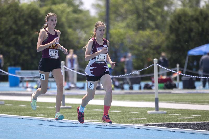 Morris’ Joy Dudley (right) competes in the 2A 3200 run Saturday, May 20, 2023 during the IHSA state track and field finals at Eastern Illinois University in Charleston.