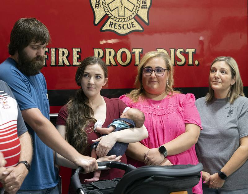 Ryan, Cheyenne and Wilder Edwards meet and thank Lee County Dispatchers Kelly Boos (left) and Jesica Knipple Thursday, May 15, 2025.