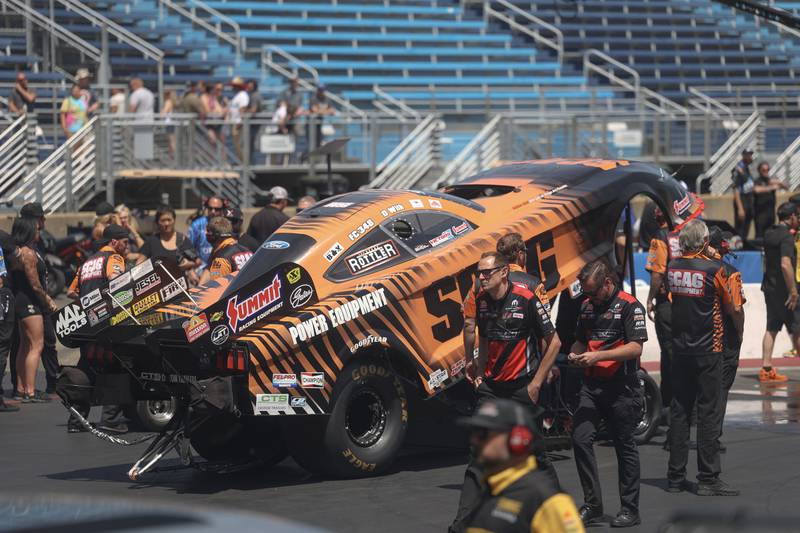 Crew members do last minute checks on Daniel Wilkerson’s car before the Funny Car quarterfinal race at the NHRA’s Gerber Collision and Glass Route 66 Nationals at Route 66 Raceway on Sunday, May 19, 2024 in Joliet.