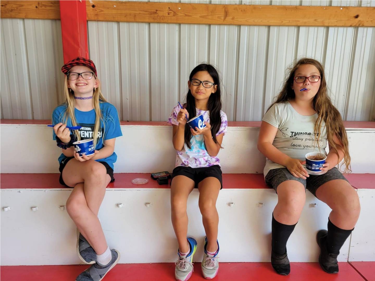 From left, Kyra Huisingh, Rachel Anton, and Rebekkah Huisingh enjoying a scoop custard after a hot day at the Whiteside County 4-H Show. Culver's in Rock Falls donated custard for 4-H members.