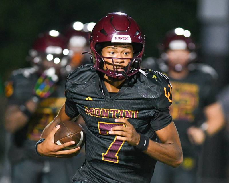 Montini Catholic's Israel Abrams (7) runs the ball during the game on Friday Sept. 19, 2025, while taking on Fenwick held at Montini Catholic High School.
