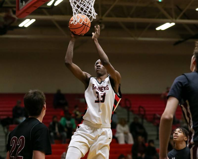 Bolingbrook's Jeremy Mccullum (33) goes in for a layup during their basketball game between Plainfield North at Bolingbrook, Friday Dec 13, 2024 in Bolingbrook.