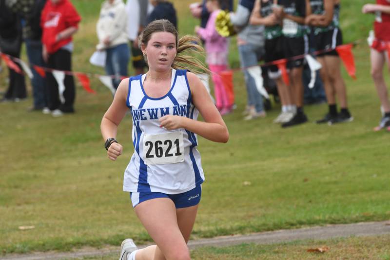 Newman's Grace King sprints to the finish line at the Amboy Columbus Day Cross Country Invitational held at Shady Oaks Country Club near Amboy on Monday, Oct. 13, 2025.