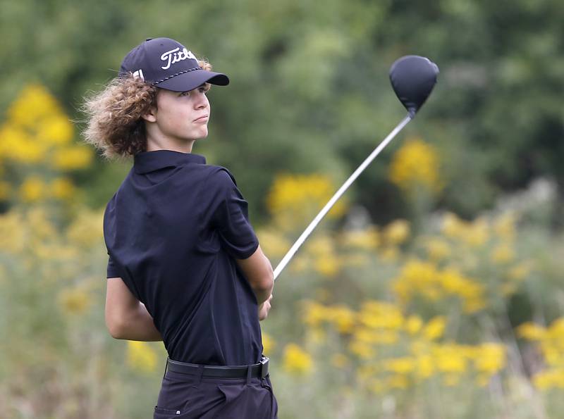 Crystal Lake Central’s Asher Johnson watches his tee shot on the seventh hole during the IHSA Class 3A Hampshire Regional golf tournament on Wednesday, Sept. 27, 2023, at Randall Oaks Golf Club in West Dundee.