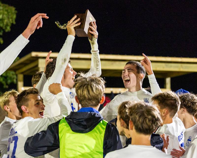 Players of Hinckley-Big Rock celebrate with trophy after winning the Little Ten Conference Championship match against Somonauk/Leland/Newark on Thursday, Oct. 9, 2025 at Hinckley-Big Rock School in Hinckley.