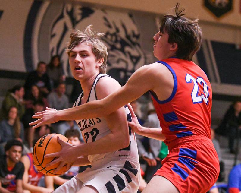 West Chicago's Tommy Doyle, right, tries to get around Glenbard South's Joey Villa (23) during the game on Friday Jan. 3, 2025, held at West Chicago High School.